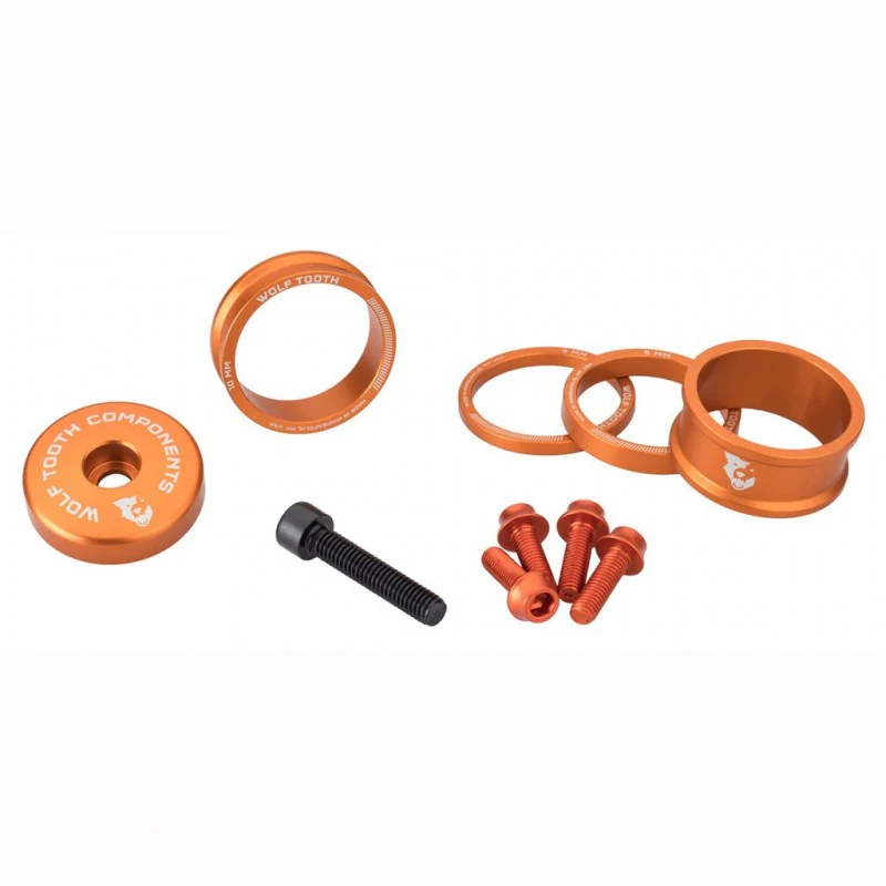 Kit mit Distanzstücken. Vorbaukappe und Schraube WOLFTOOTH BLING KIT Orange